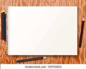 Vector illustration blank empty album for drawing format A4  with colored pencils. Clean notebook for sketches on wooden table, board, desk. Book sheet paper with spiral. 