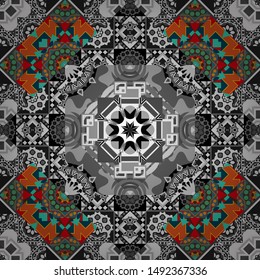 Vector illustration. Blue, gray and orange ethnic geometric motif seamless pattern on colorful abstract background.