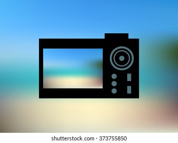 Vector illustration of blur beach, blurred nature background with black camera symbol
