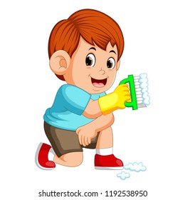 vector illustration of the boy sitting and holding the green brush to clean up the things