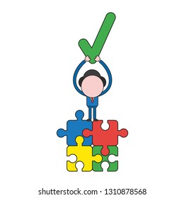 Vector illustration businessman character standing on four connected jigsaw puzzle pieces and holding up check mark. Color and black outlines.