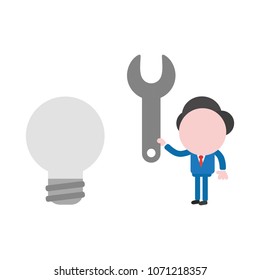 Vector illustration businessman mascot character holding spanner to gray light bulb, bad idea.