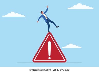 Vector illustration of a businessman struggling to maintain balance while standing on a giant warning sign, symbolizing risk, uncertainty, and navigating critical business challenges
