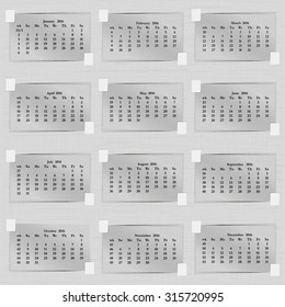 Vector illustration calendar of 2016 sheets of paper. Each month, an adhesive tape adhered to the paper background. Week starts on Sunday.
