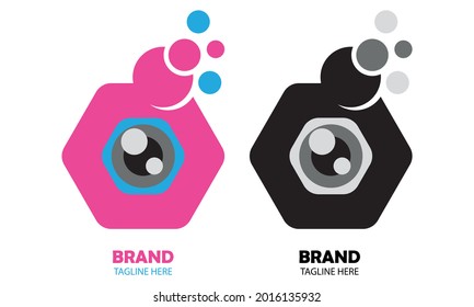 vector illustration of a camera eye in the middle of a hexagon with two color options pink and black and white. great for icons and logos, camera technology, social media.