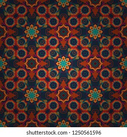 Vector illustration. It can be used in the design of textiles, in the printing industry. Kaleidoscopic seamless pattern in blue, orange and gray colors.