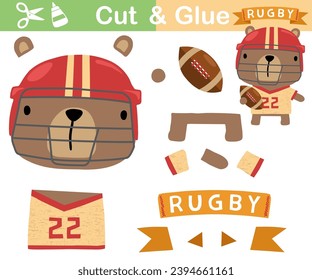 Vector illustration of cartoon bear in rugby player uniform with ball. Paper game for kids. Cut and glue