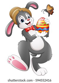Vector illustration of Cartoon bunny holding Easter egg with butterfly