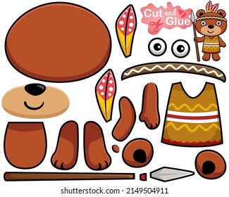 Vector illustration of cartoon cute bear in tribal costume with feather headdress holding spear. Cutout and gluing
