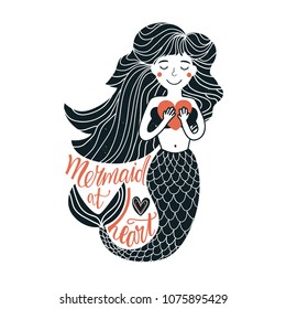 Vector illustration with cartoon mermaid holding pink heart and lettering quote Mermaid at Heart. Lovely typography poster, childish print design