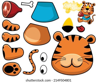 Vector illustration of cartoon tiger holding meat. Cutout and gluing