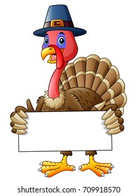 Vector illustration of Cartoon turkey holding blank sign
