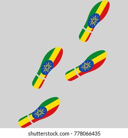 Vector illustration of chain of trails of shoes isolated on grey background, painted in the colors of national flag of Ethiopia