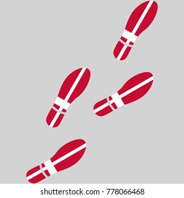 Vector illustration of chain of trails of shoes isolated on grey background, painted in the colors of national flag of Denmark