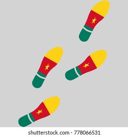 Vector illustration of chain of trails of shoes isolated on grey background, painted in the colors of national flag of Cameroon