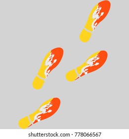 Vector illustration of chain of trails of shoes isolated on grey background, painted in the colors of national flag of Bhutan