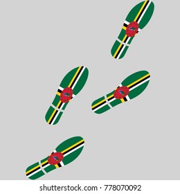 Vector illustration of chain of trails of shoes isolated on grey background, painted in the colors of national flag of Dominica