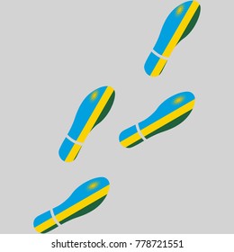 Vector illustration of chain of trails of shoes isolated on grey background, painted in the colors of national flag of Rwanda
