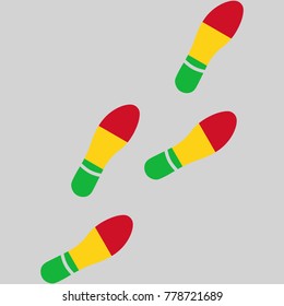 Vector illustration of chain of trails of shoes isolated on grey background, painted in the colors of national flag of Mali