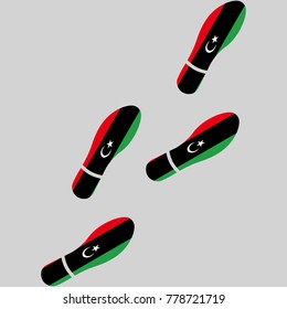 Vector illustration of chain of trails of shoes isolated on grey background, painted in the colors of national flag of Libya