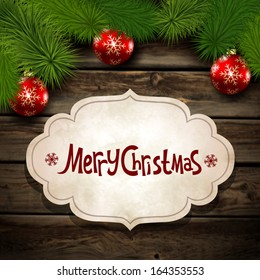 Vector illustration for Christmas with the branches of a spruce tree on the wooden background