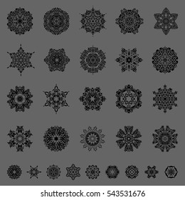 Vector illustration. Christmas set with 29 abstract snowflakes and dots on a gray background.