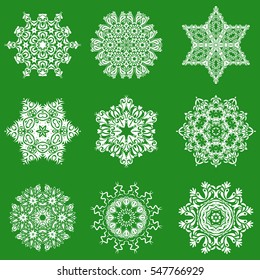 Vector illustration. Christmas set with 9 abstract snowflakes and dots on a green background.