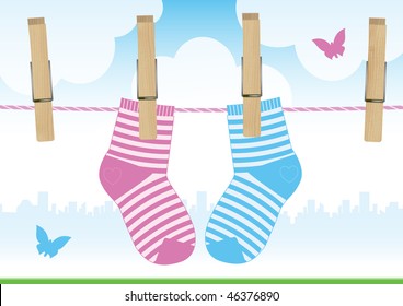 Vector illustration of a clothesline with clothespins and baby socks.