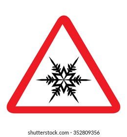 Vector illustration cold warning road sign.  Triangle sign with black silhouette snowflake