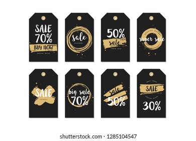Vector illustration collection of sale discount styled brush strokes banners. Golden color. Stickers set