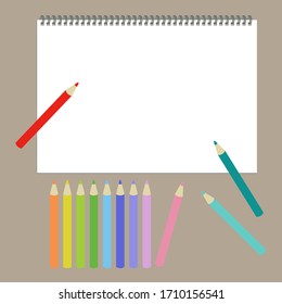 Vector illustration of colored pencils and sketchbook