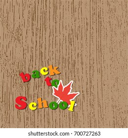 Vector illustration of colorful letters text back to school and maple leaf with copy space on brown wooden background.