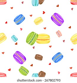 Vector illustration of colorful macarons and hearts distributed in random order to create seamless pattern
