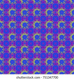 Vector illustration. Colorful Paisley seamless pattern. Mandalas. Original decorative oriental backdrop in yellow, blue and violet colors.