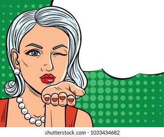 Vector illustration in comic art style of  pretty woman with winking eye. Glamour lady with blonde hair sending a flying kiss over halftone dot background