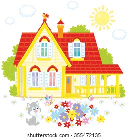 Vector illustration of a country house, a colorful flowerbed and a small grey kitten playing with a butterfly