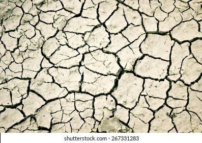 Vector illustration with cracks in the ground and dust 
