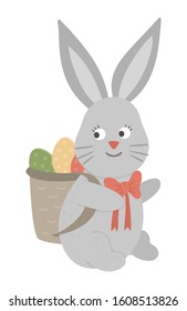 Vector illustration of cute bunny carrying a basket with colored egg isolated on white background. Easter traditional animal and design element. Cute spring icon picture