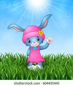 Vector illustration of Cute rabbit cartoon waving in the grass on a background of bright sunshine