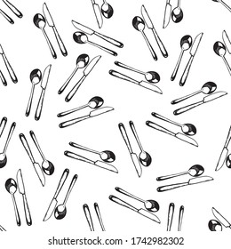 Cubertería, cuchara y cuchillo de ilustración vectorial. Negro sobre fondo blanco.