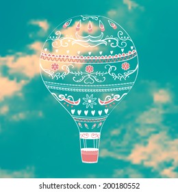 Vector illustration with decorative hot air balloon in blue sky