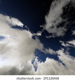 Vector illustration of deep blue sky with realistic clouds 
