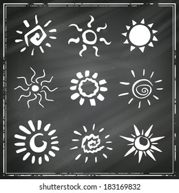 Vector Illustration of Different Abstract Suns on a Black Chalkboard