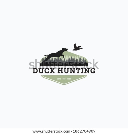 Vector illustration of dog hunt the flying duck good for duck hunting club logo, badge, and sticker design