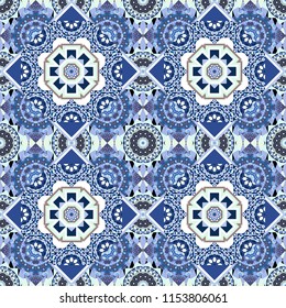 Vector illustration. Ethnic motif. Seamless pattern in white, blue and black colors. Vintage mosaics.