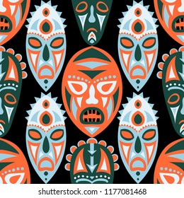 Vector Illustration. Ethnic Seamless Background with Ritual Masks for Textile or Paper. Ethnic Seamless Pattern with Color Trible Shamanic Masks for your Design. Vector Texture.