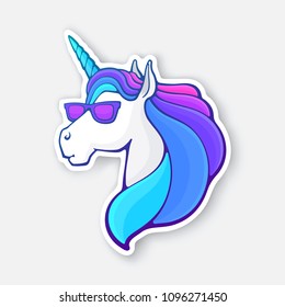 Vector illustration. Fairy tale unicorn head in sunglasses with a rainbow mane. Magic horse with horn and glasses. Imaginary mythical character. Sticker with contour. Isolated on white background