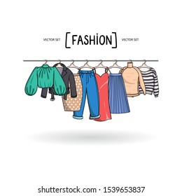 Vector illustration with fashionable women's wardrobe on hangers on white background. Background on the theme of beauty and fashion for use in design