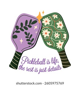 Vector illustration featuring two decorative pickleball paddles with floral designs touching at the top. Includes a playful phrase emphasizing the joy of pickleball as a lifestyle.