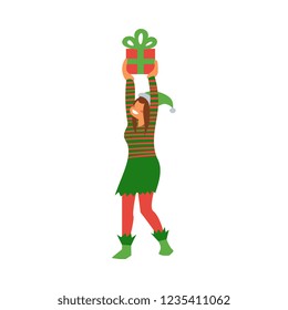 Vector illustration of female elf in green and red striped costume holding wrapped gift box over head in flat style - Santa Claus helper preparing for winter holiday isolated on white background.